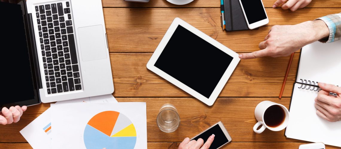 Business corporate meeting top view of table. Colleagues working on marketing strategy. Business partners discussing project, copy space